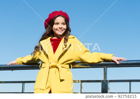 french style fashion. true parisian. kid fashion. stylish girl child after hairdresser. she has unreal curly hair. enjoy autumn day. lucky with weather. cheerful little lady. little girl outdoor 92758215
