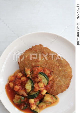 Pork cutlet with chunky vegetables and tomato sauce Pork cutlet with chunky vegetables and tomato sauce 92758714