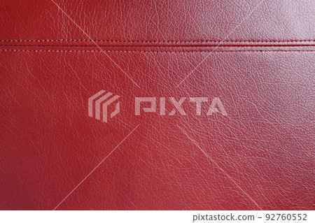 Red leather, leatherette texture background wtih decorative stich Red leather, leatherette texture background wtih decorative stich 92760552