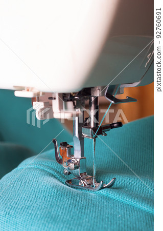 Modern sewing machine and turquoise fabric 92760691