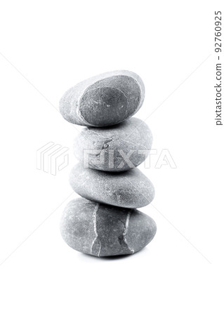Pyramid of stones over white 92760925