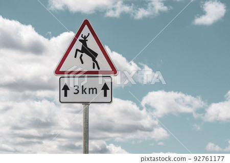 Animals crossing the road warning sign Animals crossing the road warning sign 92761177