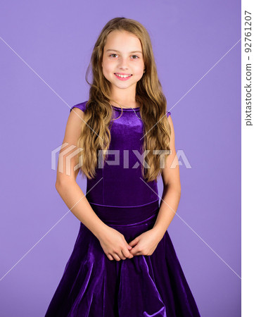 Girl cute child wear velvet violet dress. Clothes for ballroom dance. Kids fashion. Kid fashionable dress looks adorable. Ballroom dancewear fashion concept. Kid dancer satisfied with concert outfit Girl cute child wear velvet violet dress. Clothes for ballroom dance. Kids fashion. Kid fashionable dress looks adorable. Ballroom dancewear fashion concept. Kid dancer satisfied with concert outfit 92761207