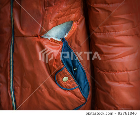 Down jacket torn at the seam 92761840