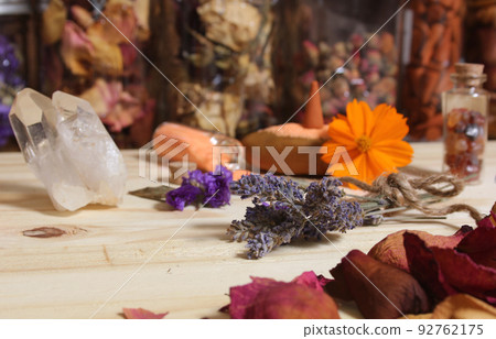Dried Lavender and Rose Petals on Table With Incense Cones and Crystals 92762175
