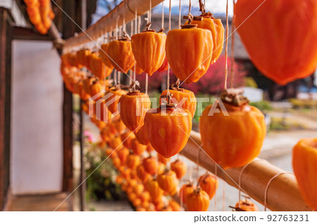(Yamanashi Prefecture) Former residence of the Takano family (licorice mansion), persimmon blinds at the eaves 92763231