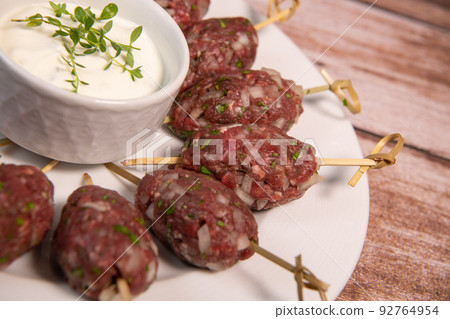 Traditional homemade kefta or kebab of meat, Halal concept. Arabic and liban food Traditional homemade kefta or kebab of meat, Halal concept. Arabic and liban food 92764954