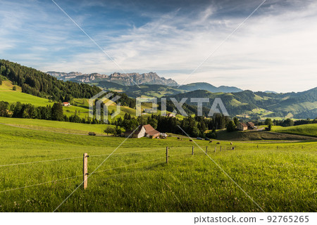 Idyllic mountain landscape in the Swiss Alps with Alpstein and Saentis mountain peak, Switzerland 92765265