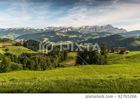 Idyllic mountain landscape in the Swiss Alps with Alpstein and Saentis mountain peak, Switzerland 92765266
