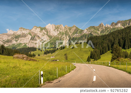 Mountain road in the Swiss Alps with view of the Alpstein massif and Saentis summit, Switzerland  92765282