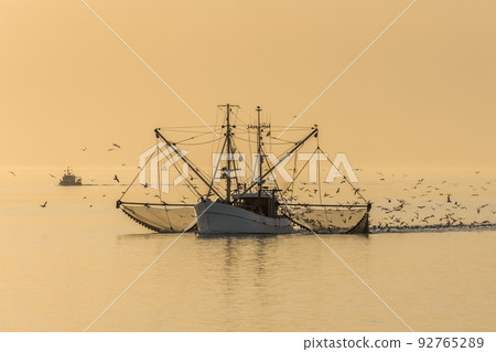 Fishing boat with trawl net Fishing boat with trawl net 92765289