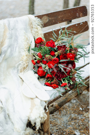 Winter wedding bouquet of red roses 92765353