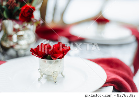 Winter Wedding decor with red roses 92765382