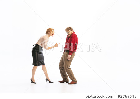 Family couple in vintage outfits sort things out isolated on white background. Concept of relationship, family, feminism, psychology of personality Family couple in vintage outfits sort things out isolated on white background. Concept of relationship, family, feminism, psychology of personality 92765583