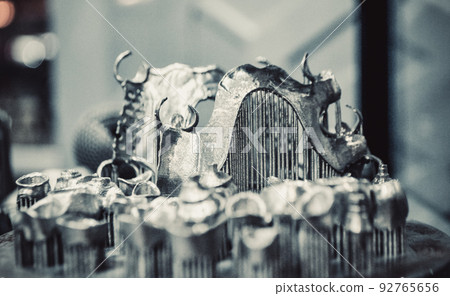 Object printed on metal 3d printer close-up. Object printed in laser sintering machine. Modern 3D printer printing from metal powder. Concept progressive additive DMLS, SLM, SLS 3d printing technology 92765656