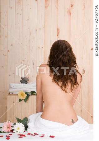 woman back in spa with towel after bodycare woman back in spa with towel after bodycare 92767756