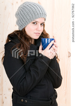 ery cold woman in a cabin in autumn or winter ery cold woman in a cabin in autumn or winter 92767862