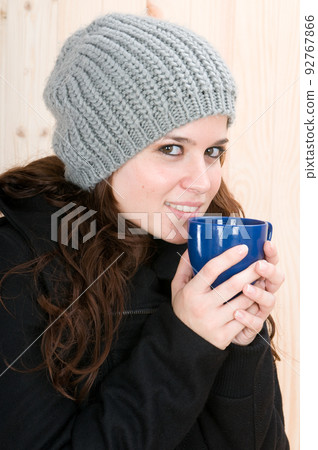 ery cold woman in a cabin in autumn or winter ery cold woman in a cabin in autumn or winter 92767866
