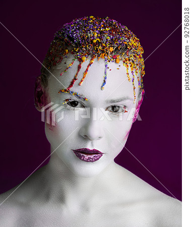 Portrait of a girl with a beaded hairstyle Portrait of a girl with a beaded hairstyle 92768018