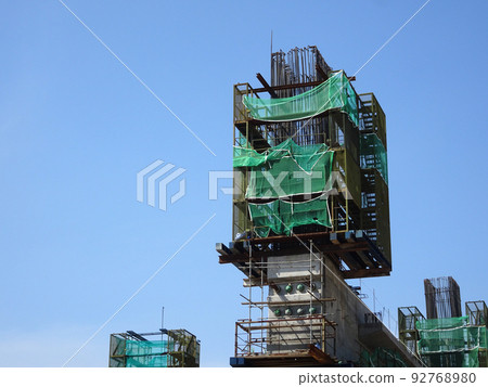 MELAKA, MALAYSIA -JULY 4, 2022: Installation of temporary scaffolding for the construction of tall concrete structures. Safety factors are prioritized to prevent accidents to workers and the public. 92768980