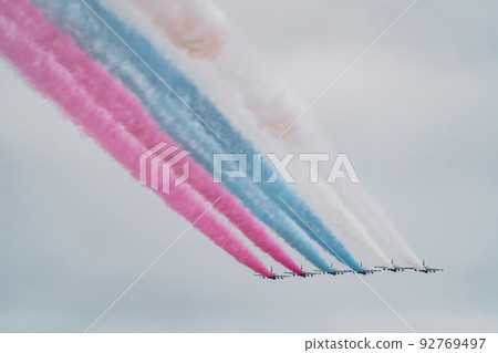 Russian Air Force planes paint the colors of the Russian flag in the sky on St. Petersburg during the celebration of the Day of the Navy Russian Air Force planes paint the colors of the Russian flag in the sky on St. Petersburg during the celebration of the Day of the Navy 92769497