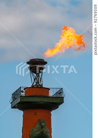 The fire of memory is lit on the rostral columns in St. Petersburg at the celebration of the day of the Russian Navy The fire of memory is lit on the rostral columns in St. Petersburg at the celebration of the day of the Russian Navy 92769509