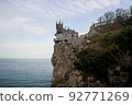 Gothic castle on a cliff overlooking the sea 92771269