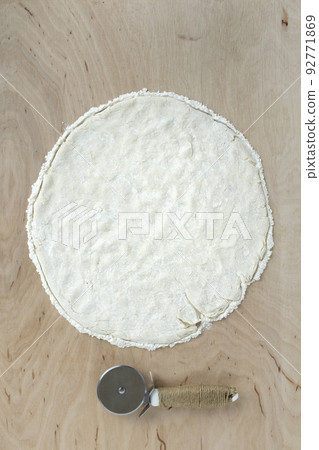 Pizza dough on wooden background 92771869