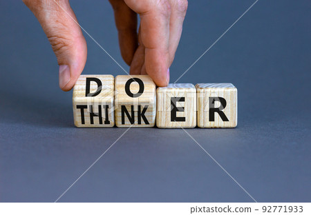 Doer or thinker symbol. Concept words Doer or thinker on wooden cubes. Businessman hand. Beautiful grey table grey background. Business and doer or thinker concept. Copy space. Doer or thinker symbol. Concept words Doer or thinker on wooden cubes. Businessman hand. Beautiful grey table grey background. Business and doer or thinker concept. Copy space. 92771933