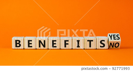 Benefits symbol. Turned a wooden cube and changed words 'benefits no' to 'benefits yes'. Beautiful orange background. Business and benefits concept, copy space. Benefits symbol. Turned a wooden cube and changed words 'benefits no' to 'benefits yes'. Beautiful orange background. Business and benefits concept, copy space. 92771993