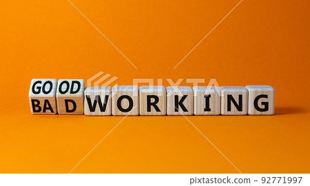 Good or bad working symbol. Turned wooden cubes and changed words bad working to good working. Beautiful orange table orange background. Business good or bad working concept, copy space. Good or bad working symbol. Turned wooden cubes and changed words bad working to good working. Beautiful orange table orange background. Business good or bad working concept, copy space. 92771997