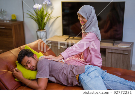 wife waking her husband up in the bed to have a breakfast wife waking her husband up in the bed to have a breakfast 92772281