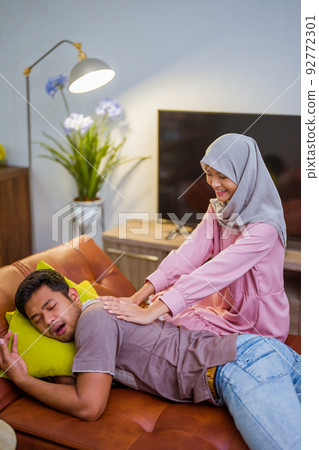 wife waking her husband up in the bed to have a breakfast wife waking her husband up in the bed to have a breakfast 92772301