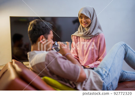 wife waking her husband up in the bed to have a breakfast wife waking her husband up in the bed to have a breakfast 92772320