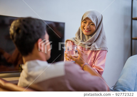 wife waking her husband up in the bed to have a breakfast wife waking her husband up in the bed to have a breakfast 92772322