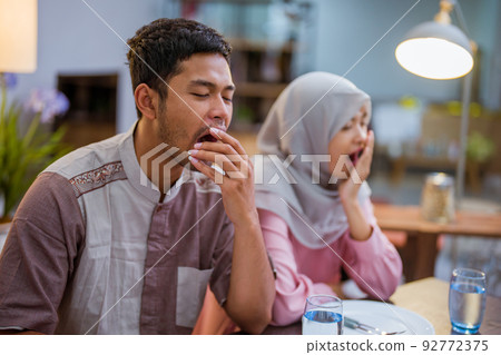 muslim couple having break fast or sahur in the morning 92772375