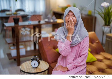 tired woman having break fast or sahur in the morning tired woman having break fast or sahur in the morning 92772402