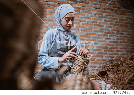 water hyacinth craftswoman in veil weaving baskets water hyacinth craftswoman in veil weaving baskets 92772452