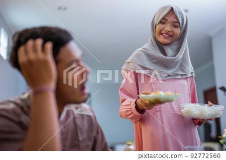 muslim couple having break fast or sahur in the morning muslim couple having break fast or sahur in the morning 92772560