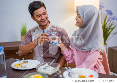 excited couple having iftar dinner time together 92772562