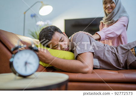 wife waking her husband up in the bed to have a breakfast wife waking her husband up in the bed to have a breakfast 92772573