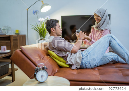 wife waking her husband up in the bed to have a breakfast wife waking her husband up in the bed to have a breakfast 92772624