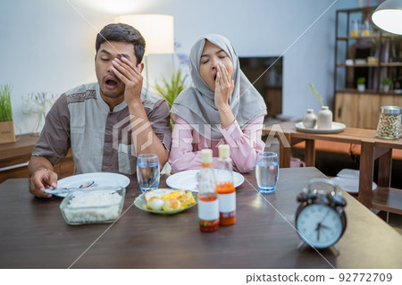 muslim couple having breakfast or sahur in morning muslim couple having breakfast or sahur in morning 92772709
