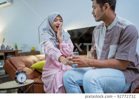 couple having a glass of water for iftar couple having a glass of water for iftar 92772732