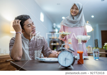 muslim couple having break fast or sahur in the morning muslim couple having break fast or sahur in the morning 92772818