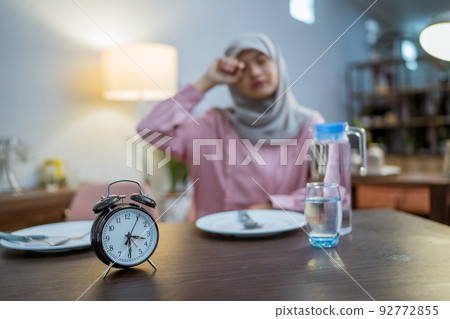 tired woman having break fast or sahur in the morning tired woman having break fast or sahur in the morning 92772855
