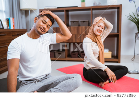 partner workout and stretching together at living room partner workout and stretching together at living room 92772880