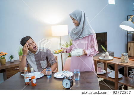 muslim couple having break fast or sahur in the morning muslim couple having break fast or sahur in the morning 92772897