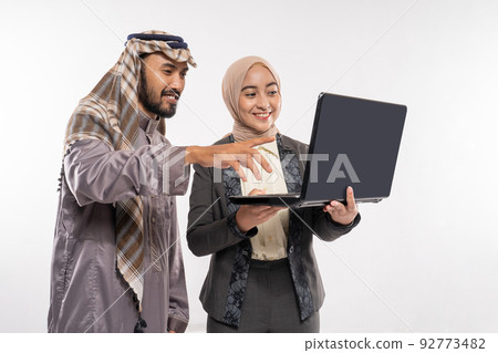 muslim business partner discussing and meeting using laptop pc 92773482