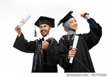 Excited female and male graduate students with clenched hands Excited female and male graduate students with clenched hands 92773936